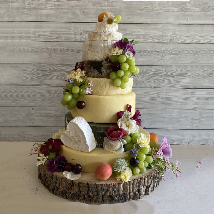 10 Tips for a Cheese Wheel Wedding Cake  Bridal Musings  Cheese wedding  cake Wedding cake rustic Wedding cake alternatives